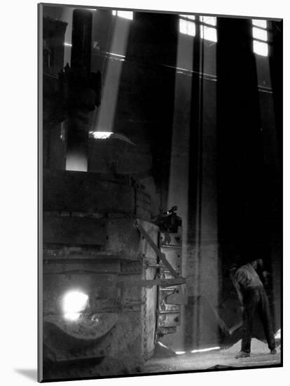 Worker Shoveling Limestone Into an Electric Blast Furnace at Republic Steel Mill-Margaret Bourke-White-Mounted Photographic Print