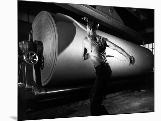 Worker Tearing Off a Sample from a Roll of Paper to Test Its Quality-Margaret Bourke-White-Mounted Photographic Print