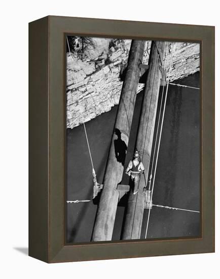 Worker Walking on the Texas Illinois Natural Gas Company's Pipeline Suspension Bridge-John Dominis-Framed Premier Image Canvas