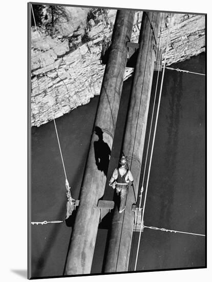 Worker Walking on the Texas Illinois Natural Gas Company's Pipeline Suspension Bridge-John Dominis-Mounted Photographic Print