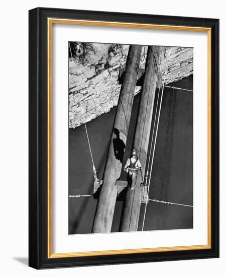 Worker Walking on the Texas Illinois Natural Gas Company's Pipeline Suspension Bridge-John Dominis-Framed Photographic Print