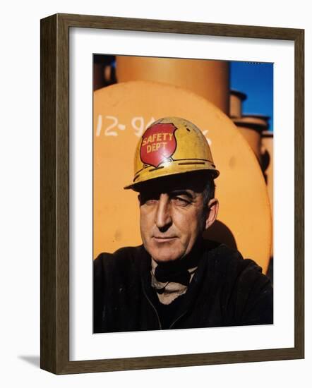 Worker Wearing Safety Helmet Outside at Sun Shipbuilding and Dry Dock Co. Shipyards-Dmitri Kessel-Framed Photographic Print
