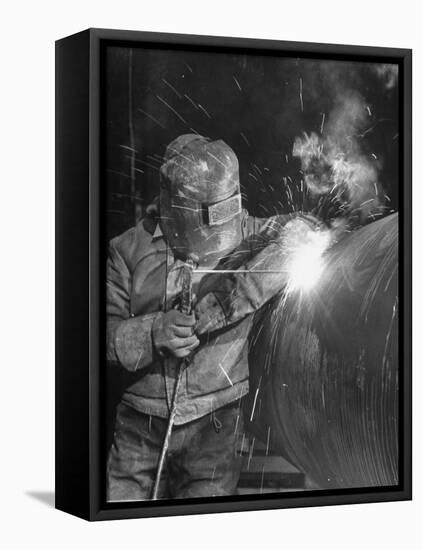 Worker Welding Pipe Used in Natural Gas Pipeline at World's Biggest Coal Fueled Generating Plant-Margaret Bourke-White-Framed Premier Image Canvas