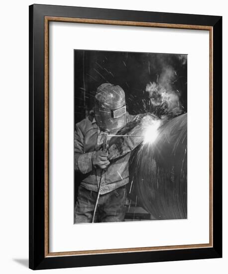 Worker Welding Pipe Used in Natural Gas Pipeline at World's Biggest Coal Fueled Generating Plant-Margaret Bourke-White-Framed Premium Photographic Print