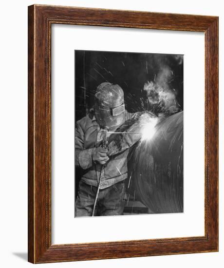 Worker Welding Pipe Used in Natural Gas Pipeline at World's Biggest Coal Fueled Generating Plant-Margaret Bourke-White-Framed Premium Photographic Print