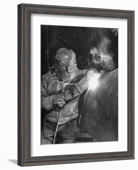 Worker Welding Pipe Used in Natural Gas Pipeline at World's Biggest Coal Fueled Generating Plant-Margaret Bourke-White-Framed Photographic Print