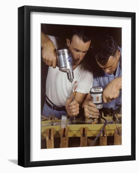 Workers Assembling Parts For a Consolidated Aircraft-Dmitri Kessel-Framed Photographic Print