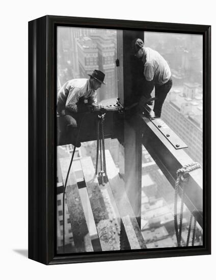 Workers balancing on steel beam above streets during construction of the Manhattan Company Building-Arthur Gerlach-Framed Premier Image Canvas