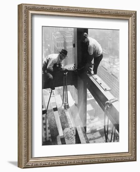 Workers balancing on steel beam above streets during construction of the Manhattan Company Building-Arthur Gerlach-Framed Photographic Print