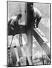 Workers balancing on steel beam above streets during construction of the Manhattan Company Building-Arthur Gerlach-Mounted Photographic Print