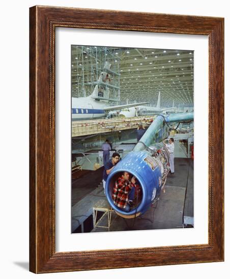 Workers Building the Engine of a DC-8 Passenger Jet at the Douglas Aircraft Plant-Ralph Crane-Framed Photographic Print