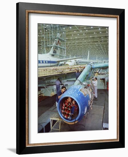 Workers Building the Engine of a DC-8 Passenger Jet at the Douglas Aircraft Plant-Ralph Crane-Framed Photographic Print