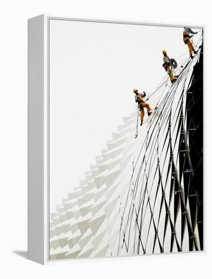 Workers Climb Down the Roof of Singapore's Spikey Fruit Shaped Esplanade Arts Center-null-Framed Premier Image Canvas