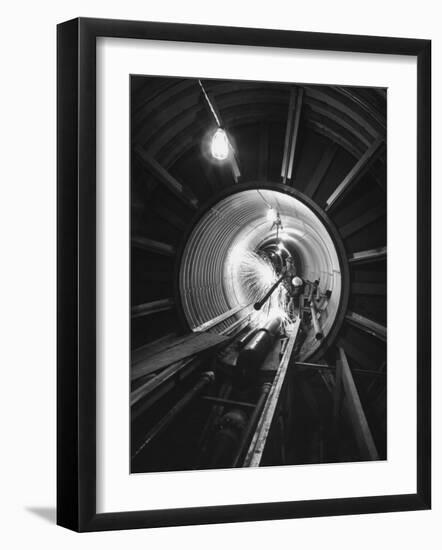 Workers Connecting Sections of Water Pipe in Tunnel-Ralph Crane-Framed Photographic Print