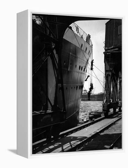 Workers Hanging from Hull of Ship in Hamburg Harbor, in the Midst of Painting It-Emil Otto Hoppé-Framed Premier Image Canvas