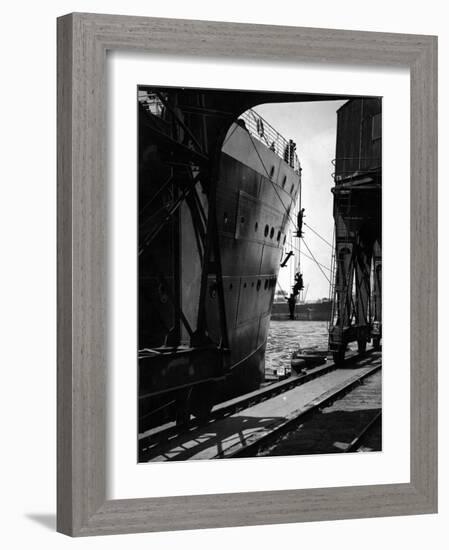 Workers Hanging from Hull of Ship in Hamburg Harbor, in the Midst of Painting It-Emil Otto Hoppé-Framed Photographic Print