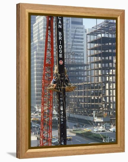 Workers Service Crane Across Street from National Bank Building under Construction on Park Ave-Dmitri Kessel-Framed Premier Image Canvas