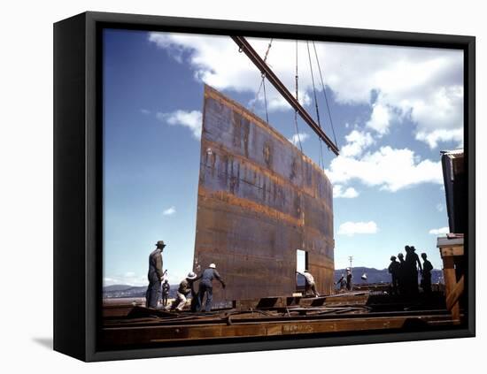 Workers Watching as Steel Beam is Raised High Above During Sub Assembling of Ship at Shipyard-Hansel Mieth-Framed Premier Image Canvas