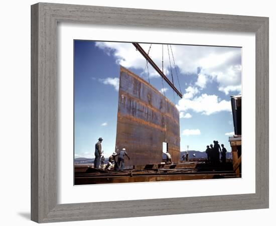 Workers Watching as Steel Beam is Raised High Above During Sub Assembling of Ship at Shipyard-Hansel Mieth-Framed Photographic Print