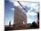 Workers Watching as Steel Beam is Raised High Above During Sub Assembling of Ship at Shipyard-Hansel Mieth-Mounted Photographic Print