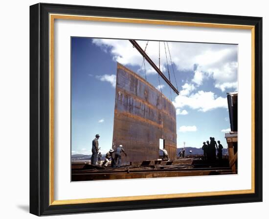 Workers Watching as Steel Beam is Raised High Above During Sub Assembling of Ship at Shipyard-Hansel Mieth-Framed Photographic Print