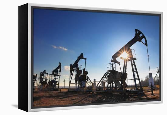 Working Oil Pumps Silhouette against Sun-Kokhanchikov-Framed Premier Image Canvas