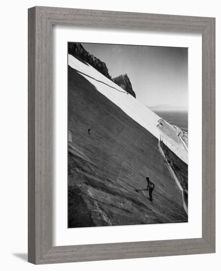 Workman Cleaning Concrete Which Catches Rain Water on Gibraltar-Ralph Crane-Framed Photographic Print