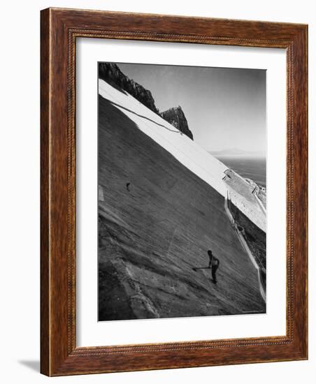 Workman Cleaning Concrete Which Catches Rain Water on Gibraltar-Ralph Crane-Framed Photographic Print