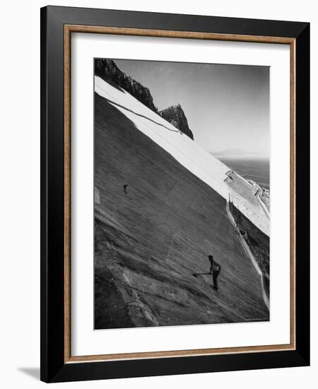 Workman Cleaning Concrete Which Catches Rain Water on Gibraltar-Ralph Crane-Framed Photographic Print