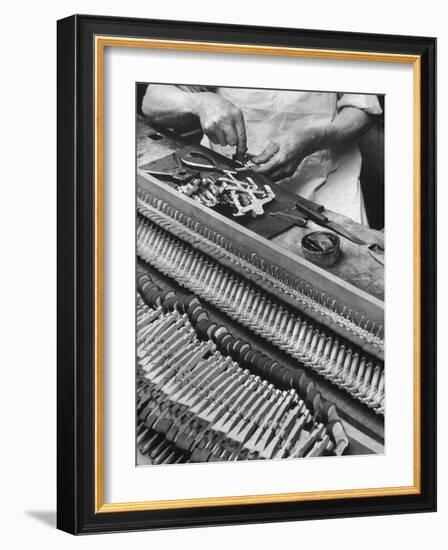 Workman Installing Some of the Whippens, Shanks and Hammers at the Steinway Piano Factory-Margaret Bourke-White-Framed Photographic Print