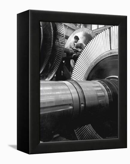 Workman on Large Wheel That Looks Like Fan, at General Electric Laboratory-Alfred Eisenstaedt-Framed Premier Image Canvas