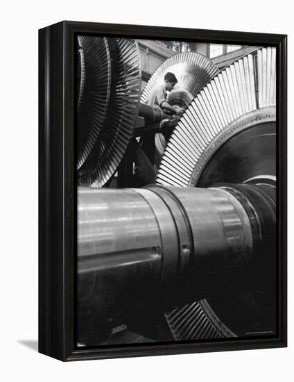 Workman on Large Wheel That Looks Like Fan, at General Electric Laboratory-Alfred Eisenstaedt-Framed Premier Image Canvas