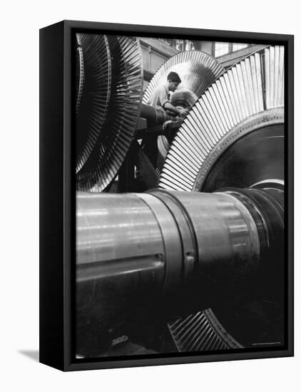 Workman on Large Wheel That Looks Like Fan, at General Electric Laboratory-Alfred Eisenstaedt-Framed Premier Image Canvas