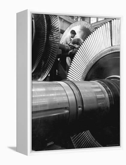 Workman on Large Wheel That Looks Like Fan, at General Electric Laboratory-Alfred Eisenstaedt-Framed Premier Image Canvas