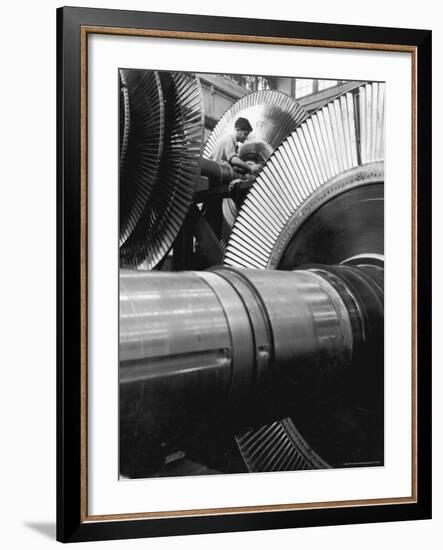 Workman on Large Wheel That Looks Like Fan, at General Electric Laboratory-Alfred Eisenstaedt-Framed Premium Photographic Print