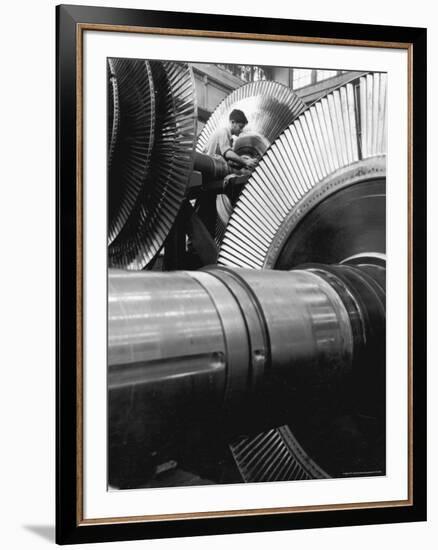 Workman on Large Wheel That Looks Like Fan, at General Electric Laboratory-Alfred Eisenstaedt-Framed Premium Photographic Print