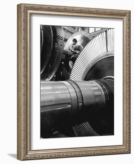 Workman on Large Wheel That Looks Like Fan, at General Electric Laboratory-Alfred Eisenstaedt-Framed Photographic Print