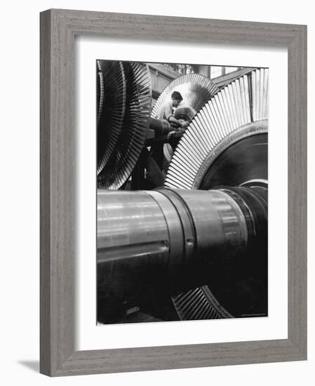 Workman on Large Wheel That Looks Like Fan, at General Electric Laboratory-Alfred Eisenstaedt-Framed Photographic Print