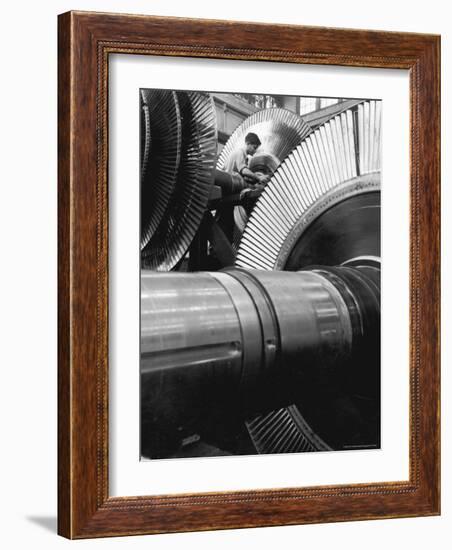 Workman on Large Wheel That Looks Like Fan, at General Electric Laboratory-Alfred Eisenstaedt-Framed Photographic Print