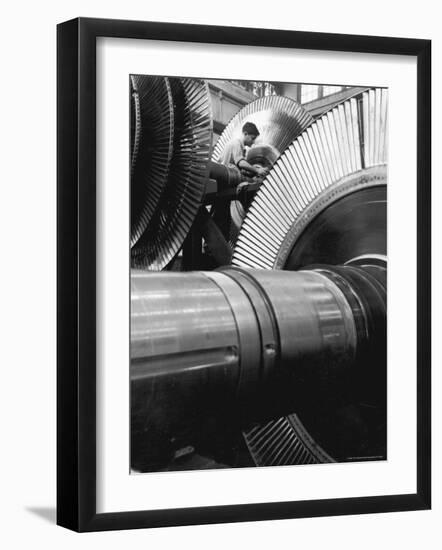 Workman on Large Wheel That Looks Like Fan, at General Electric Laboratory-Alfred Eisenstaedt-Framed Photographic Print