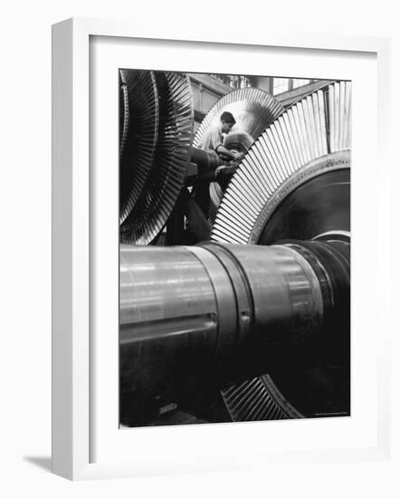 Workman on Large Wheel That Looks Like Fan, at General Electric Laboratory-Alfred Eisenstaedt-Framed Photographic Print