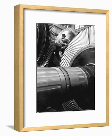 Workman on Large Wheel That Looks Like Fan, at General Electric Laboratory-Alfred Eisenstaedt-Framed Photographic Print