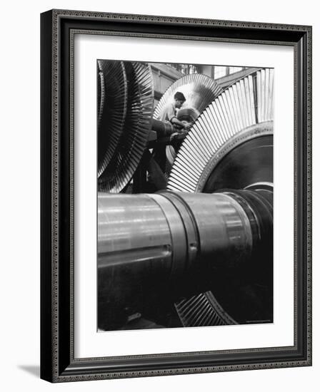 Workman on Large Wheel That Looks Like Fan, at General Electric Laboratory-Alfred Eisenstaedt-Framed Photographic Print