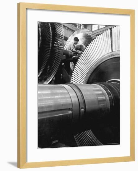 Workman on Large Wheel That Looks Like Fan, at General Electric Laboratory-Alfred Eisenstaedt-Framed Photographic Print