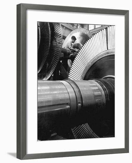 Workman on Large Wheel That Looks Like Fan, at General Electric Laboratory-Alfred Eisenstaedt-Framed Photographic Print