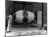 Workman Standing Next to Atomic Bomb Number 2, Nicknamed Fat Man, Hours before its Deployment-null-Mounted Photographic Print