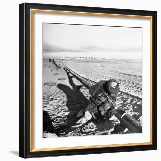 Workman Welding a Pipe to Another For the Purpose of Bringing Drinking Water Into Kuwait-Thomas D^ Mcavoy-Framed Photographic Print