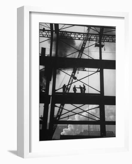 Workmen Against Smokey Sky as They Stand on Girders of the New Carnegie Illinois Steel Plant-Margaret Bourke-White-Framed Photographic Print