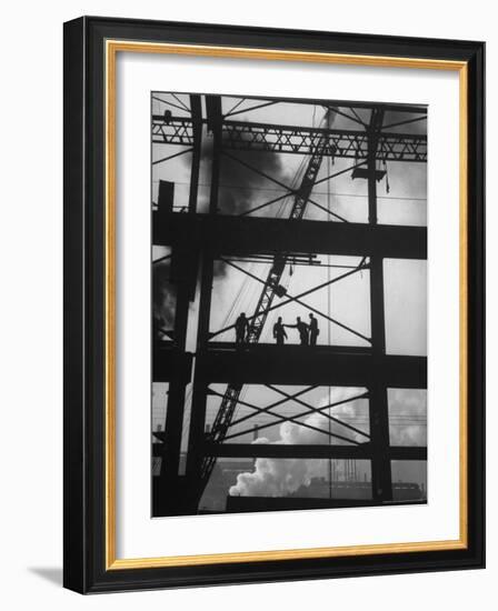 Workmen Against Smokey Sky as They Stand on Girders of the New Carnegie Illinois Steel Plant-Margaret Bourke-White-Framed Photographic Print