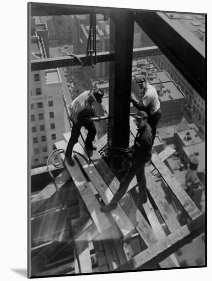 Workmen Attach Steel Beams Above Street During Construction of the Manhattan Company Building-Arthur Gerlach-Mounted Photographic Print